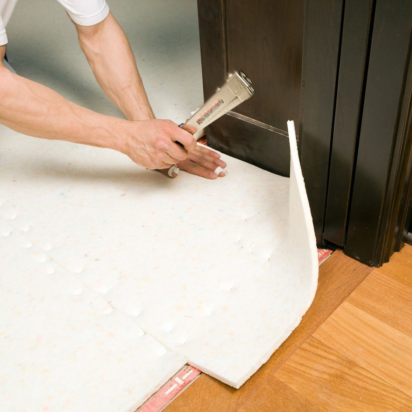 closeup of person installing underlayment - Rickway Carpet in North Mankato, MN