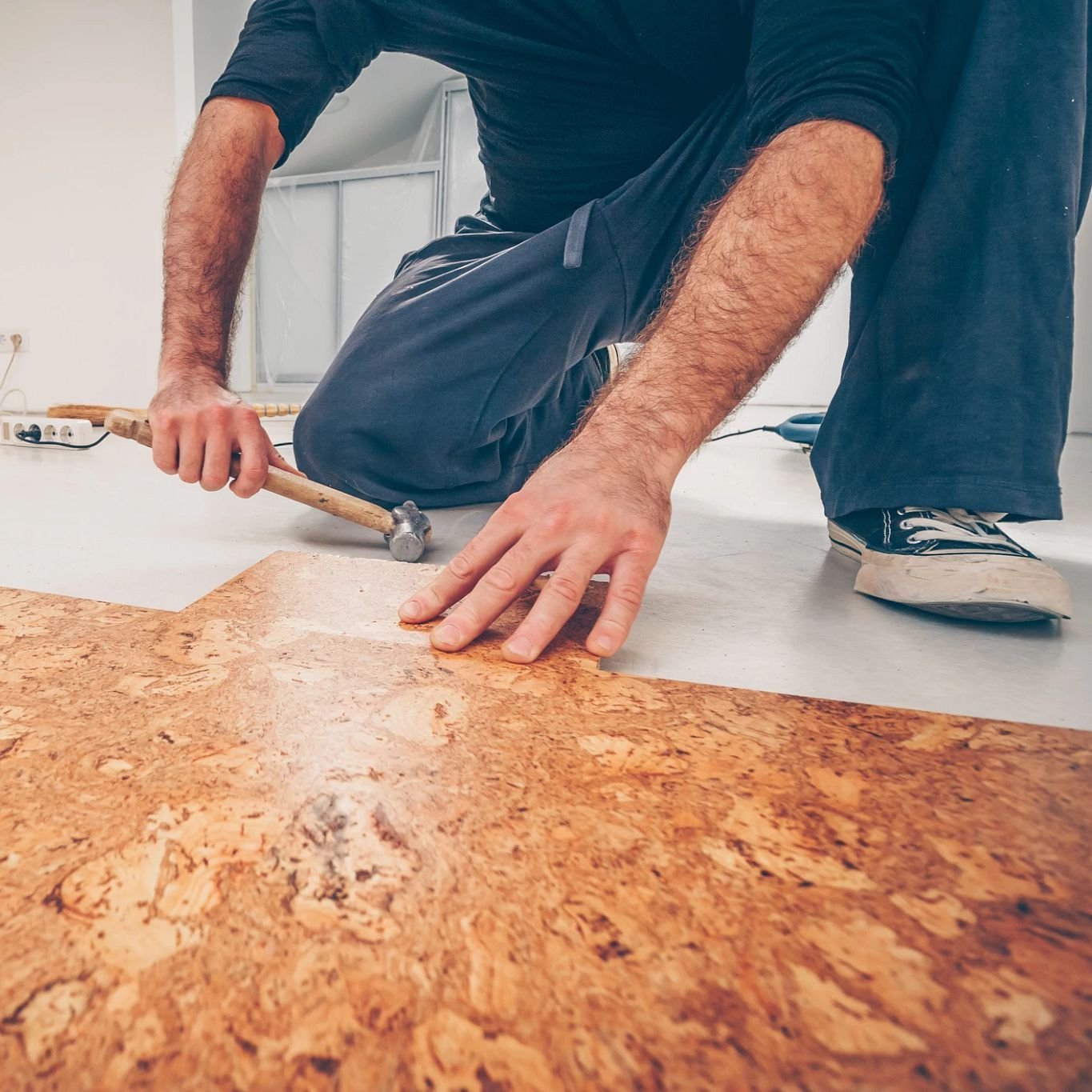 closeup of person installing cork flooring - Rickway Carpet in North Mankato, MN